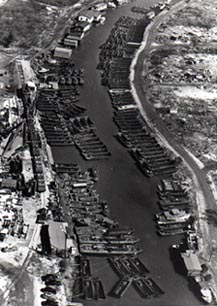 Aerial view of Bayou St. John with Higgins  LCVPs, LCSs, and PT-Boats awaiting shipment.